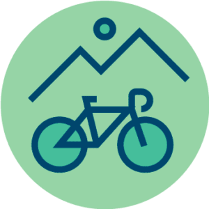 Grønn sirkel med omriss av et enkelt fjell og en sykkel i mørkeblå